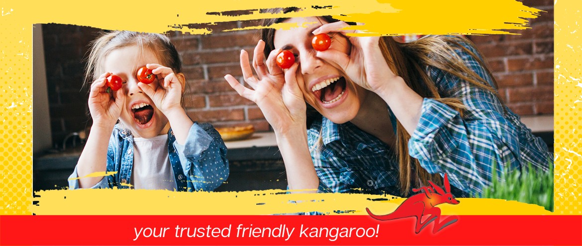Mom and daughter being silly while making a salad