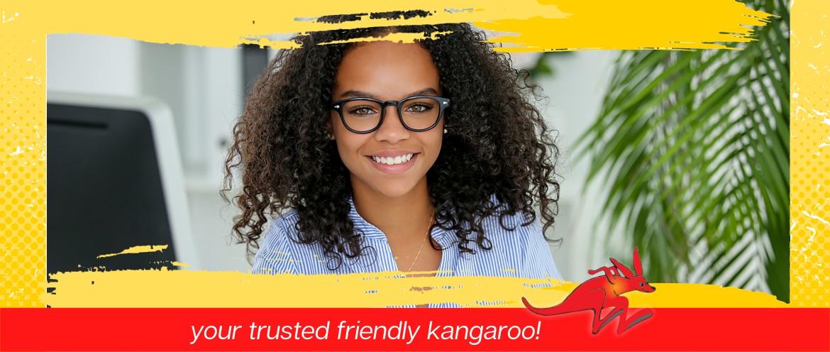 Smiling young women sitting at a desk