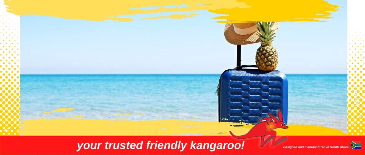 Suitcase, hat, pineapple on beach